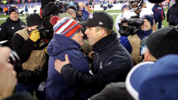 In a controversial move John Harbaugh kisses Belichick on the mouth after a loss in January 2015